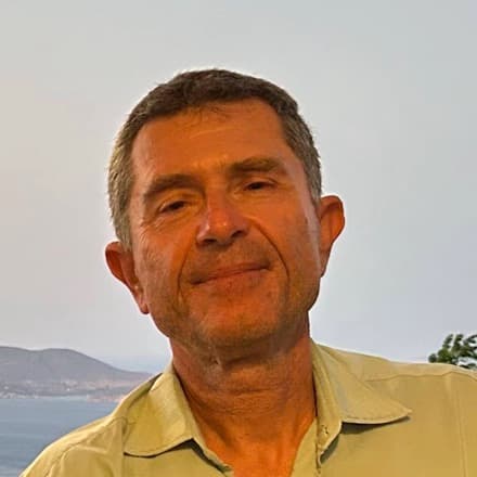 Stefanos Tsakonas, with the sea and hillside behind him