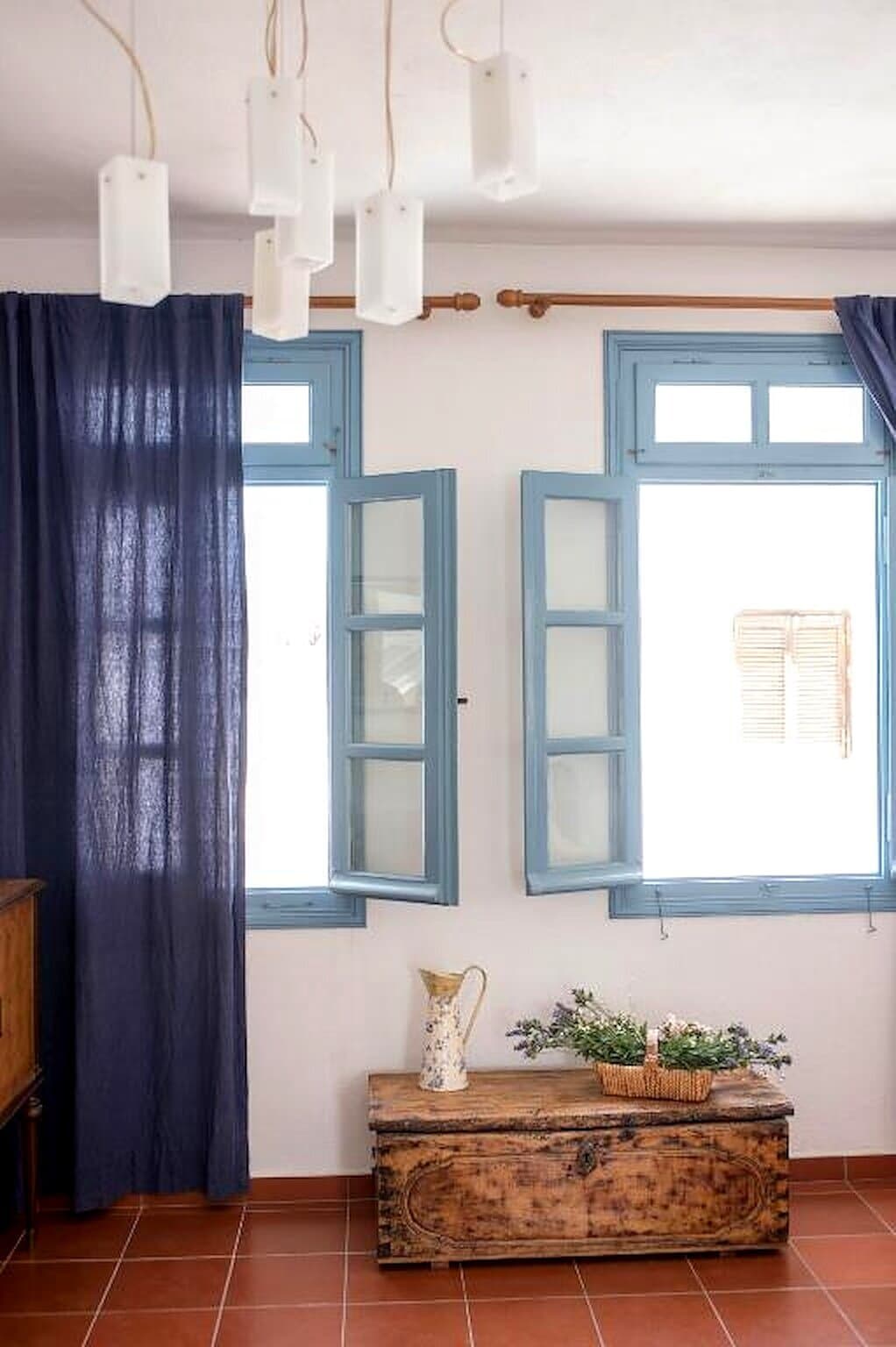 Blue shutters and an antique chest