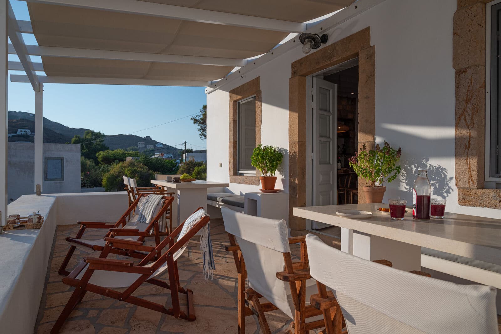 Dining on the terrace under the pergola
