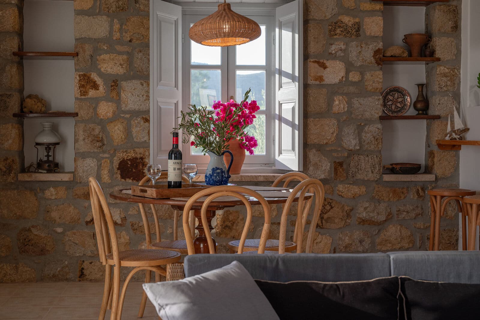 The dining table against the old stone wall